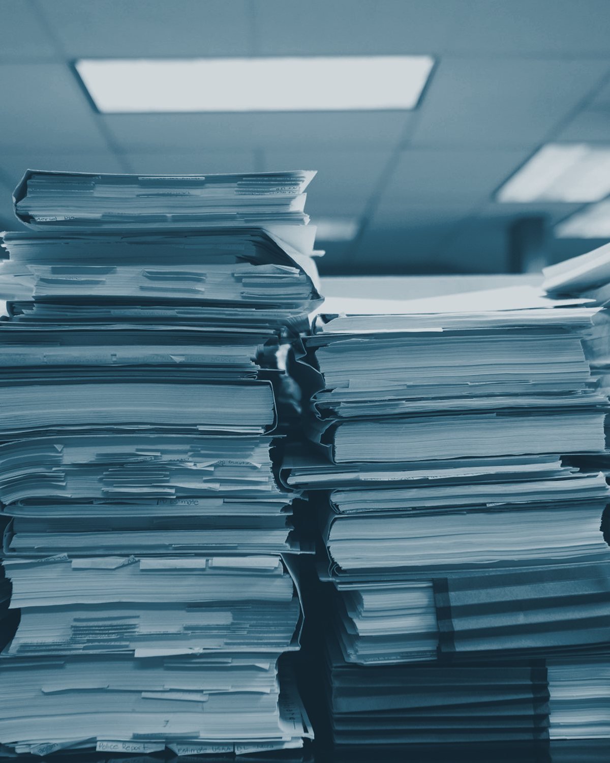 Stacked case files, in indigo duotone