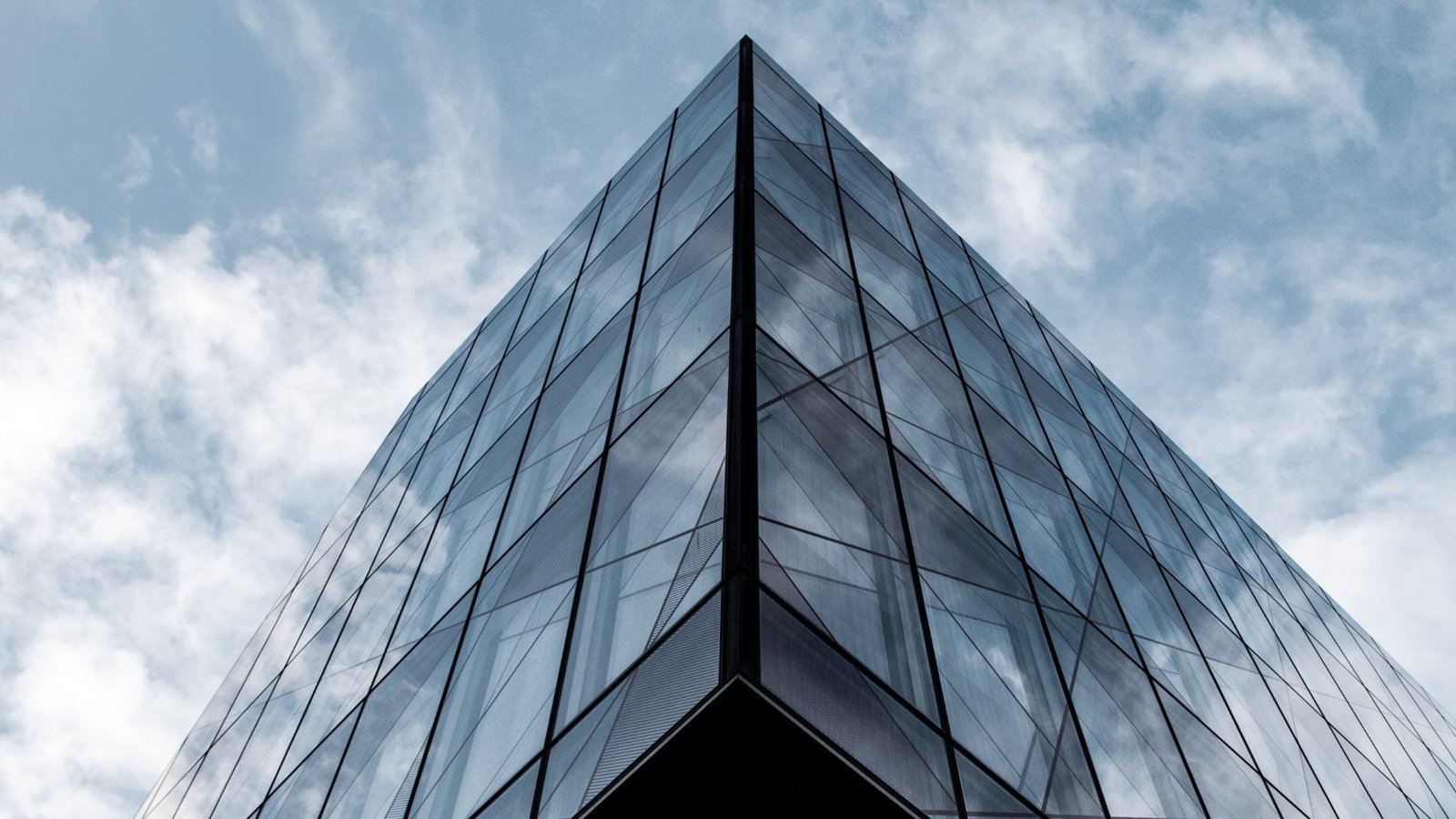 A glass tower rising into the sky